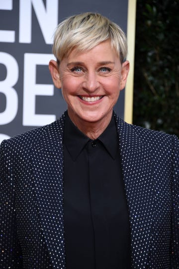 ellen degeneres smiles while wearing polka dot blazer and black collared shirt