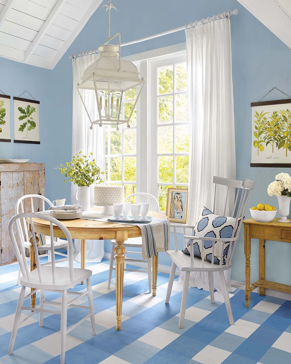 dining room with wooden table and white chairs