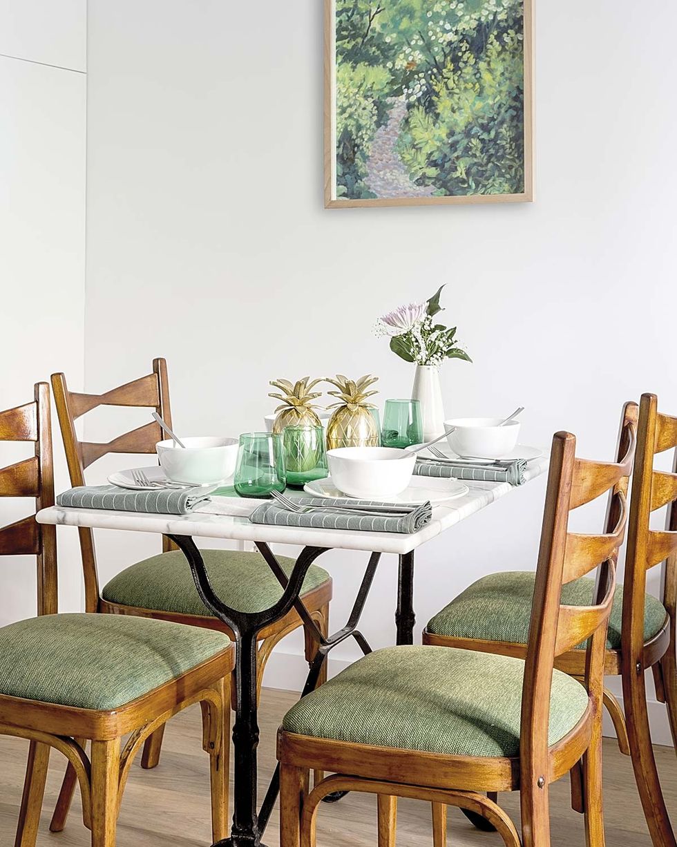 vintage dining room with iron and marble table and retro chairs