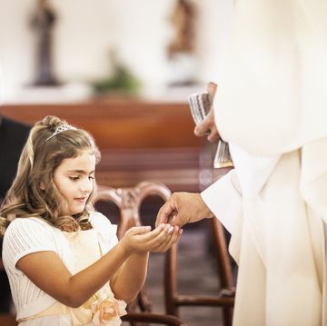 communion scripture girl taking her first communion at church