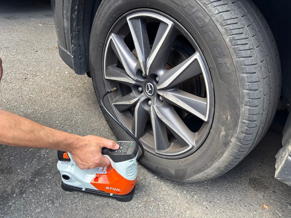 inflating a car tire using an air compressor