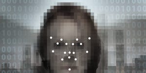 Concept image of a digitised face overlaid with a biometric facial recognition pattern