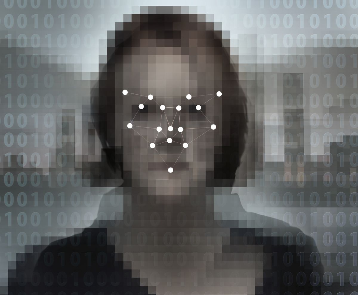 Concept image of a digitised face overlaid with a biometric facial recognition pattern