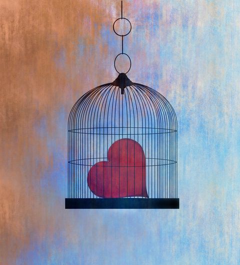 concept of a heart trapped in a cage signifying loneliness