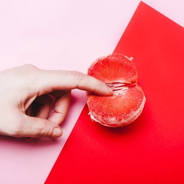 concept sex, masturbation hand, fingers in grapefruit