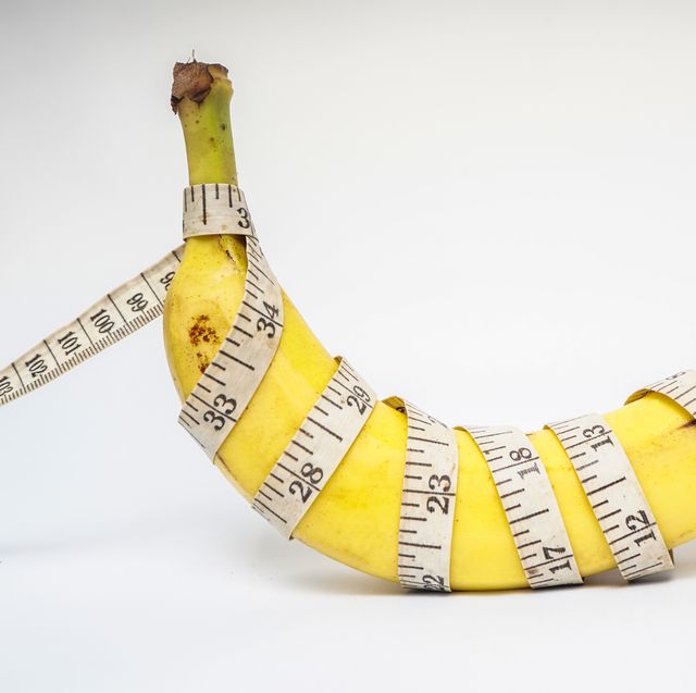 conceptual illustration for penis size, banana with plastic tailor meter on white background