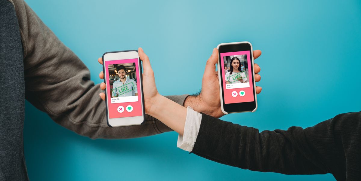 conceptual image of two hands holding smart phones with an online dating app on the screen