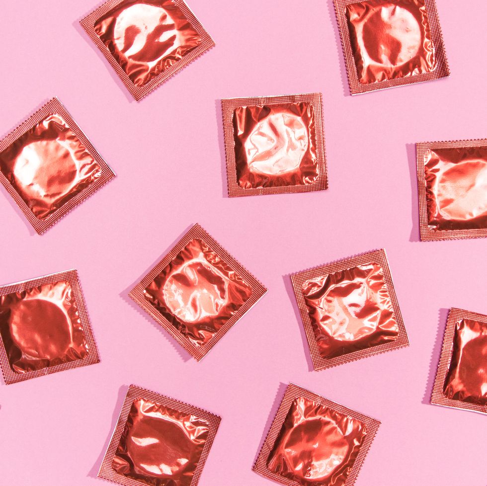 condoms on pink background