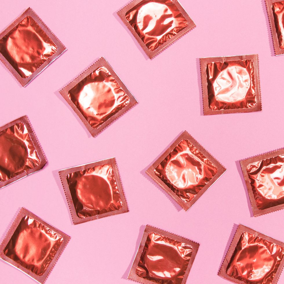condoms on pink background