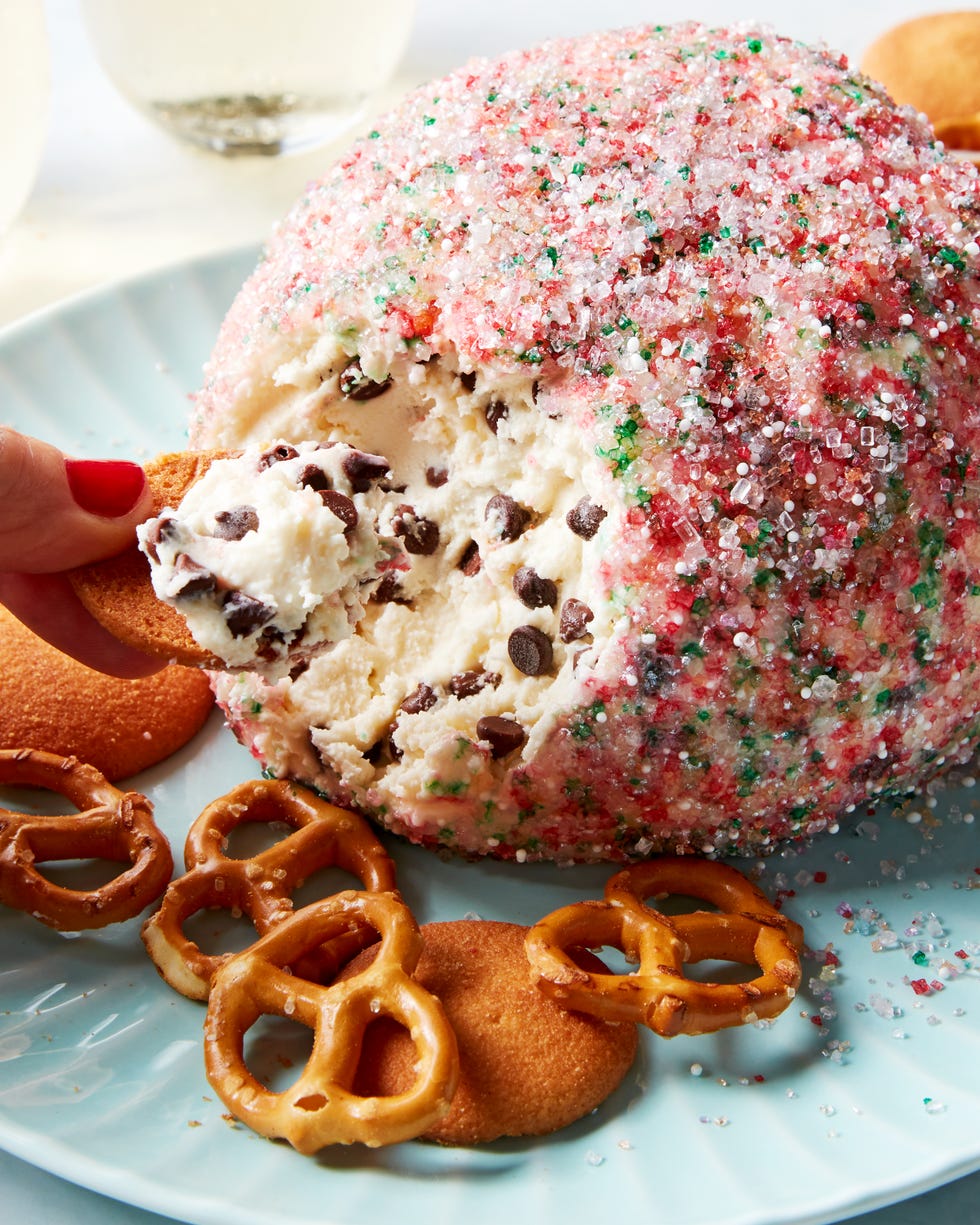 chocolate chip cookie dough ball rolled in sprinkles served with pretzels and nilla wafers