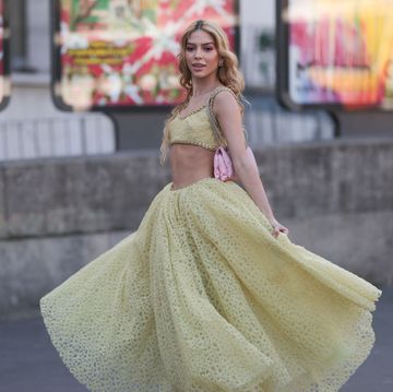 paris, france march 03 jordanna maia seen wearing a yellow giambattista valli matching set with a cropped top and a tulle long skirt, a pink bag and matching sparkling sandals before the giambattista valli show on march 03, 2023 in paris, france photo by jeremy moellergetty images