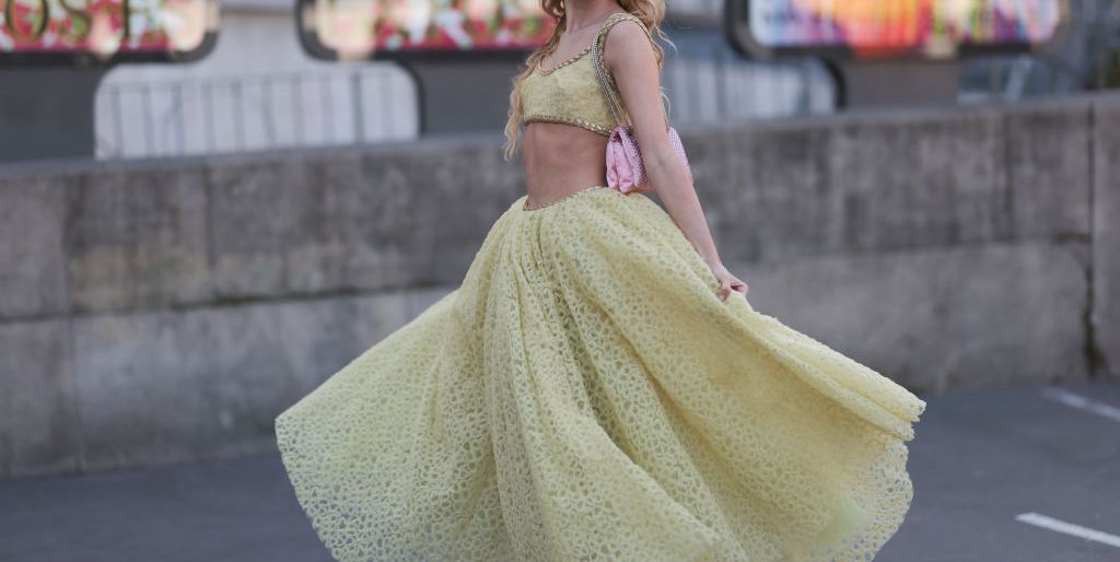 paris, france march 03 jordanna maia seen wearing a yellow giambattista valli matching set with a cropped top and a tulle long skirt, a pink bag and matching sparkling sandals before the giambattista valli show on march 03, 2023 in paris, france photo by jeremy moellergetty images