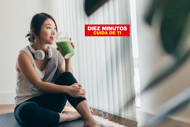 beautiful young asian woman in sportswear drinking protein shake after exercise, relaxing at home