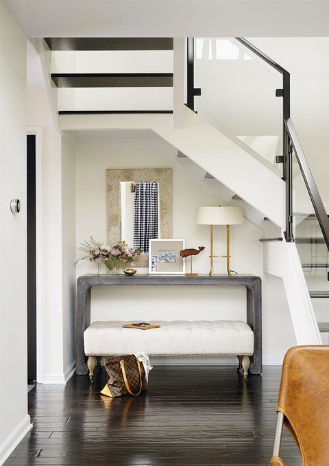 entryway with console table and mirror and bench