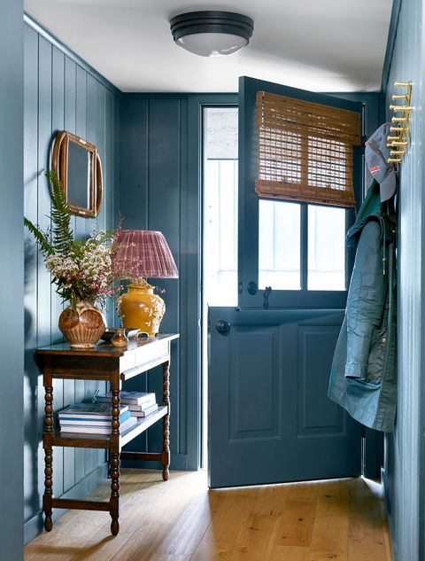 blue entryway with dutch door and console table
