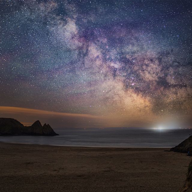 gower beach by night with a starry sky and moonlight