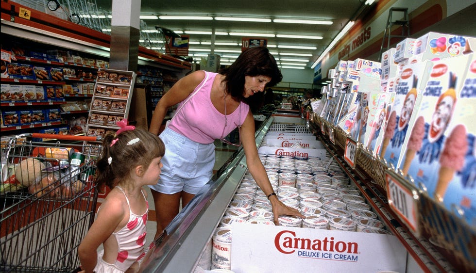 consumers shopping for groceries at supermarket