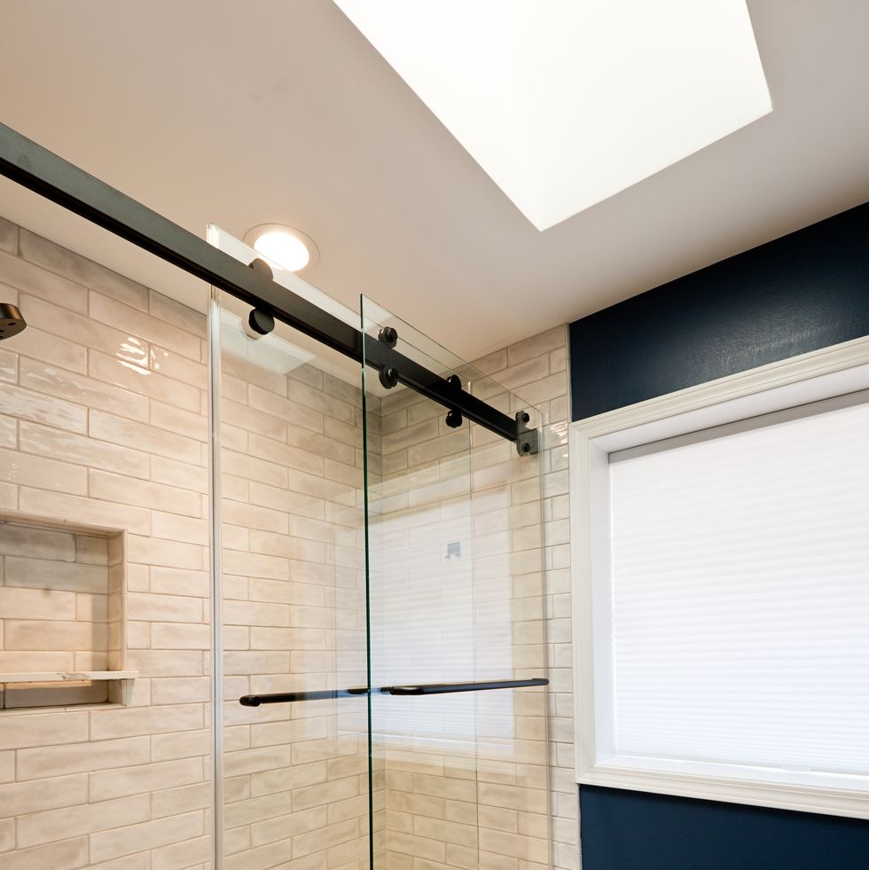 contemporary bathroom design with glass shower stall enclosed bathtub