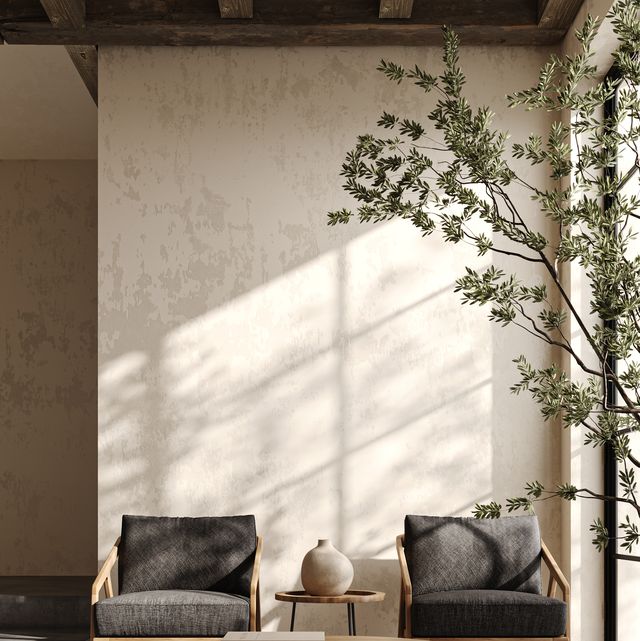contemporary living room with chic wooden armchairs and a circular coffee table under warm natural lighting. 3d render