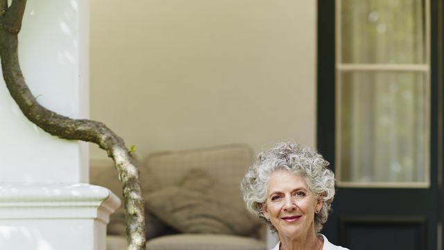 contented senior woman sitting at porch