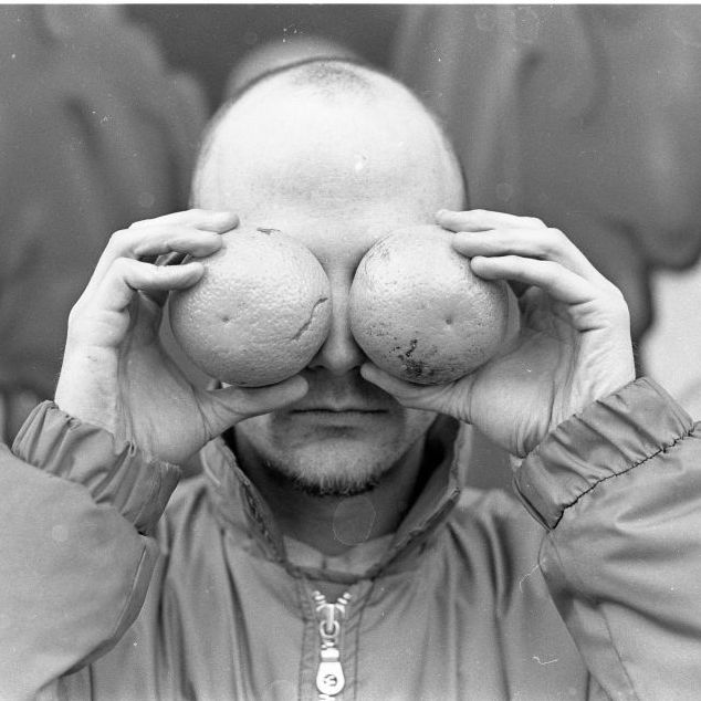 american musician, dj, record producer, singer, songwriter, and photographer moby, portrait, holding fruit over his eyes, in east village, new york , united states, 1995 photo by martyn goodacregetty images