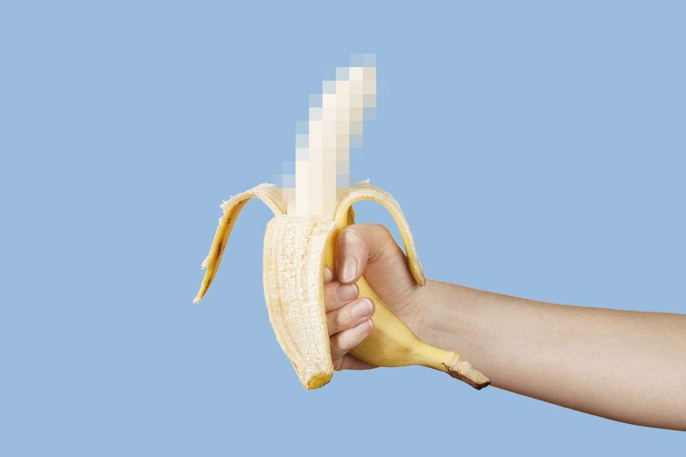 hidden censored banana in hand on a blue background horny aroused penis, male erection and sexual education funny pornography