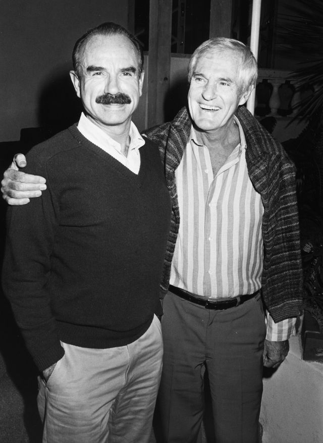 g gordon liddy and timothy leary smiling and embracing for a photo
