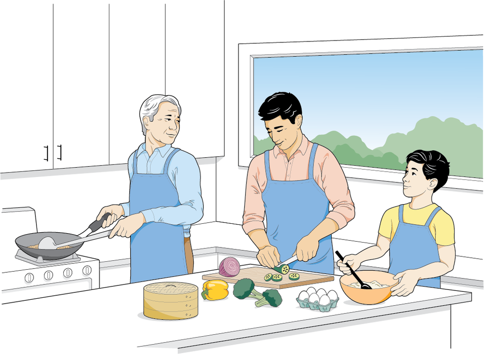 three individuals cooking in a kitchen setting
