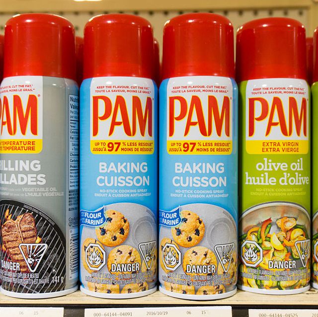 PAM: cooking sprays in store shelf. PAM is a brand name by...