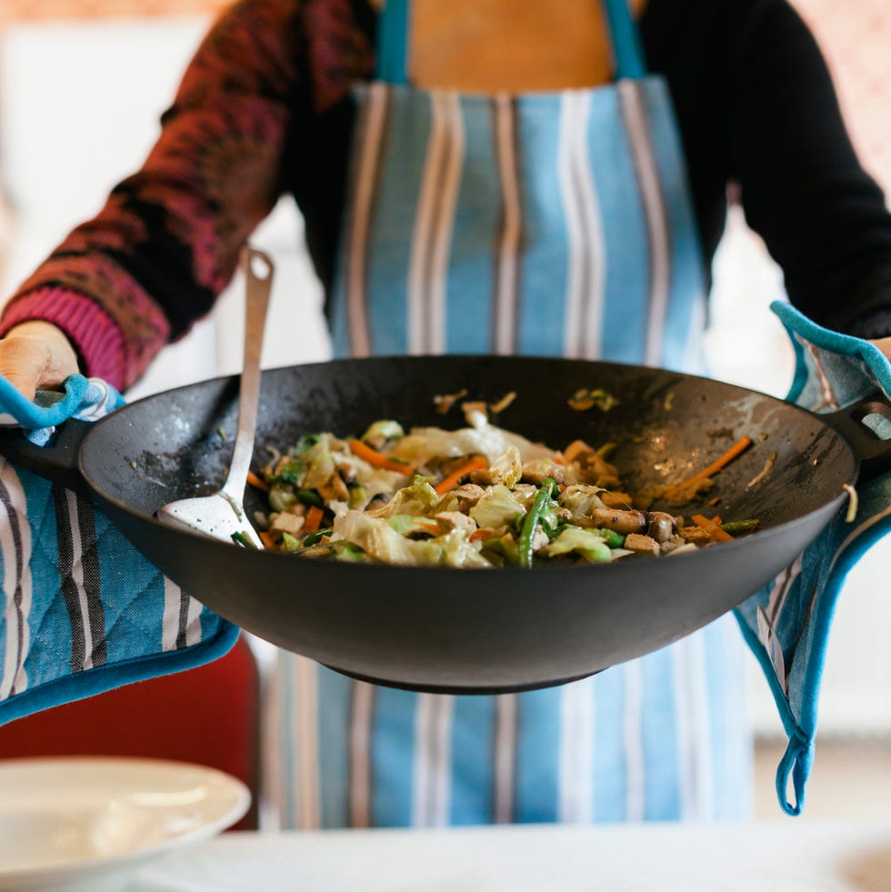 cooking wok filled with a steamy dish