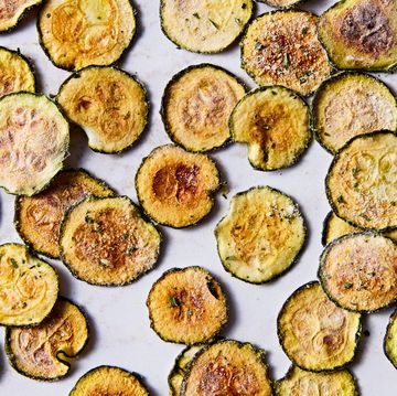 thinly sliced and baked zucchini rounds with cool ranch seasoning