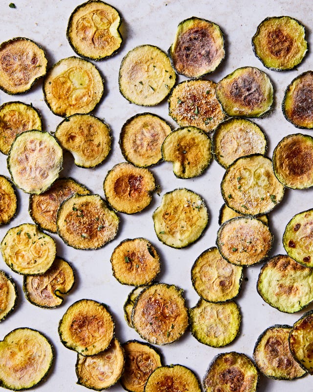 thinly sliced and baked zucchini rounds with cool ranch seasoning