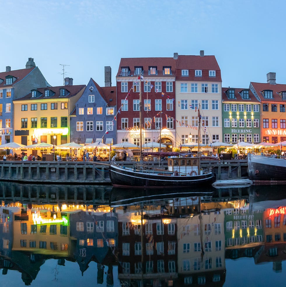 View of illuminated buildings in city of Copenhagen against sky,Nyhavn,Denmark copenhangen denmark