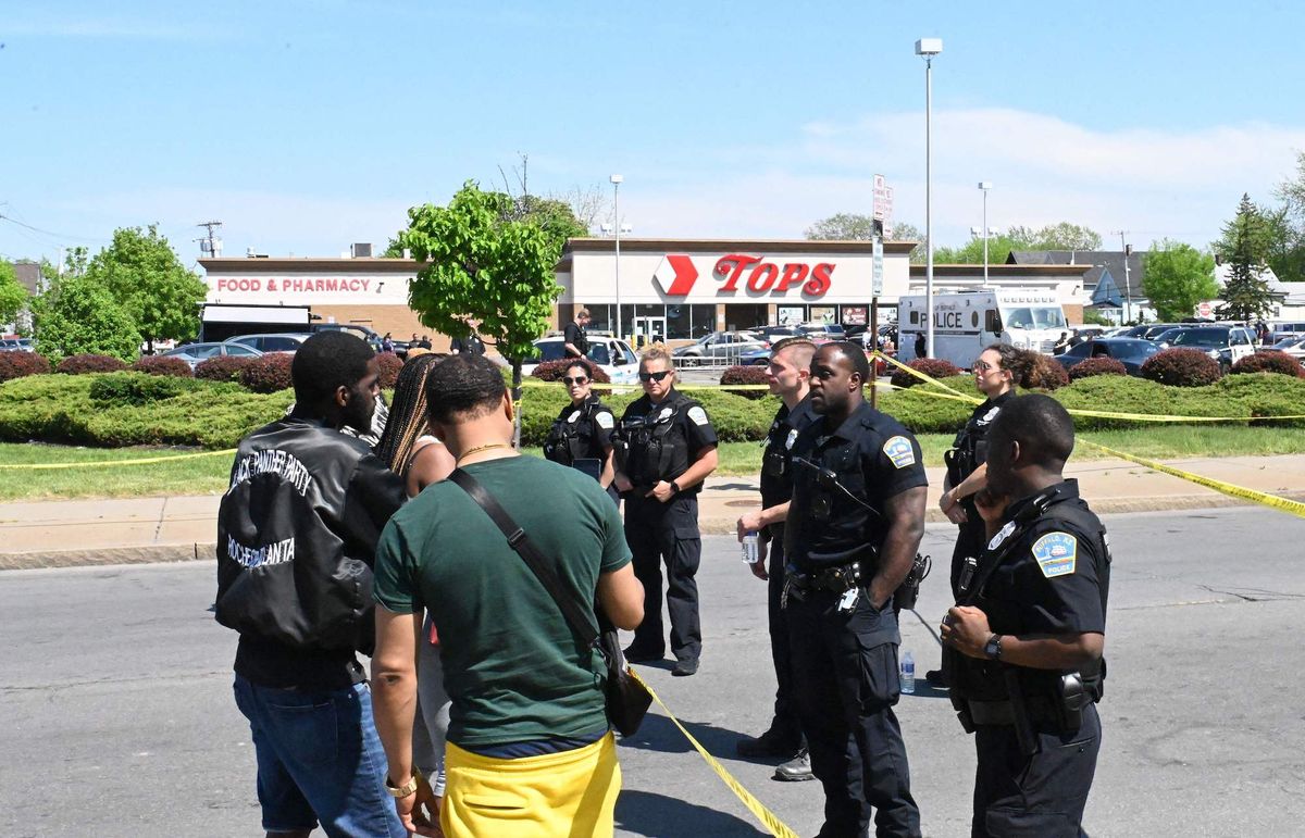 police and mourners gather near a tops grocery store in buffalo, new york, on may 15, 2022   grieving residents from the us city of buffalo held vigils sunday after a white gunman who officials have deemed "pure evil" shot dead 10 people at a grocery store in a racially motivated rampage photo by usman khan  afp  the erroneous mentions appearing in the metadata of this photo by usman ukalizai has been modified in afp systems in the following manner byline is usman khan instead of usman ukalizai please immediately remove the erroneous mentions from all your online services and delete it them from your servers if you have been authorized by afp to distribute it them to third parties, please ensure that the same actions are carried out by them failure to promptly comply with these instructions will entail liability on your part for any continued or post notification usage therefore we thank you very much for all your attention and prompt action we are sorry for the inconvenience this notification may cause and remain at your disposal for any further information you may require photo by usman khanafp via getty images