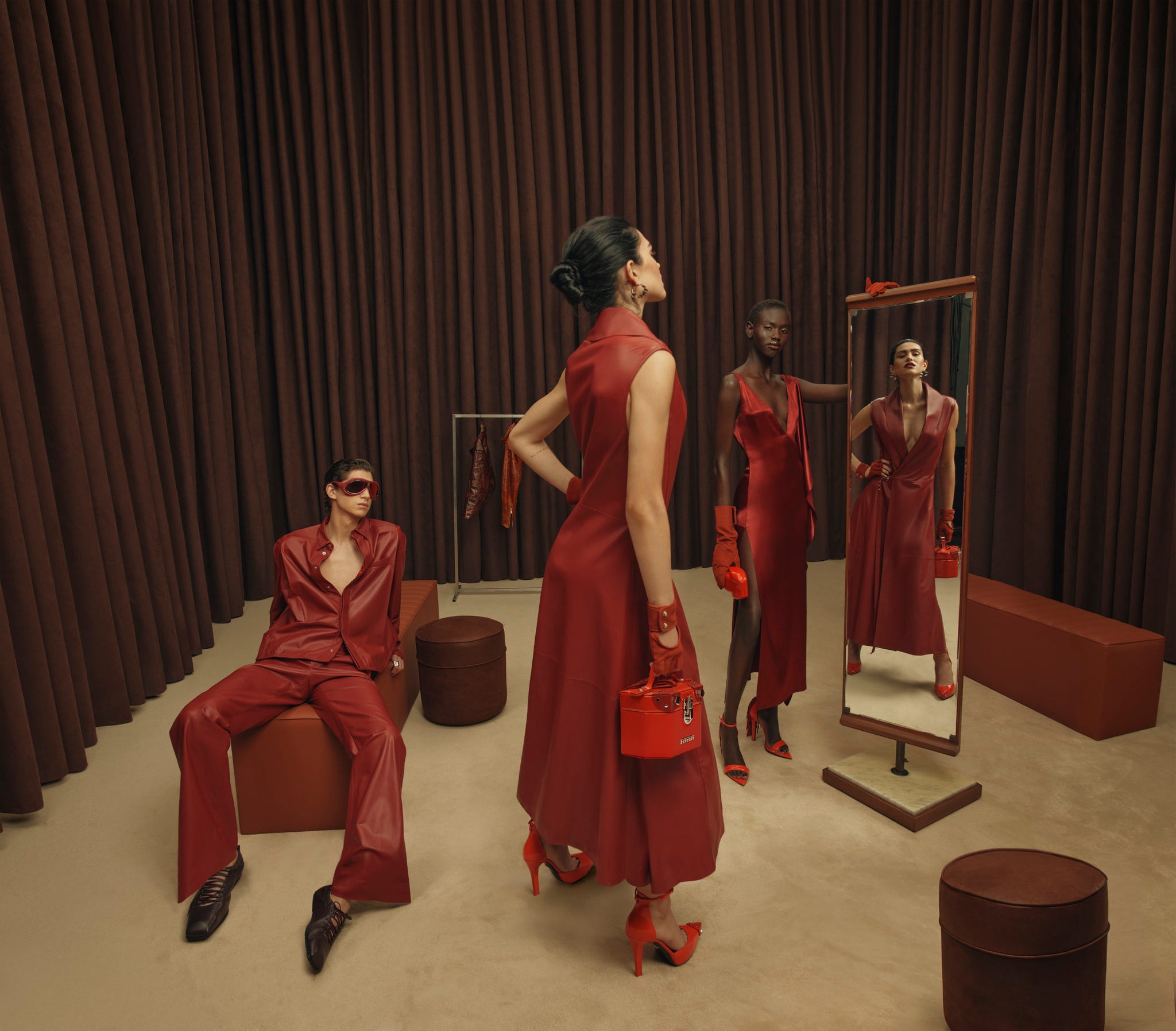 fashion showcase featuring models in red attire with accessories
