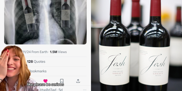 a person smiling next to a bottle of wine