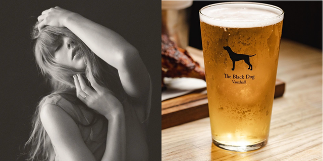 a glass of beer next to a painting of a woman