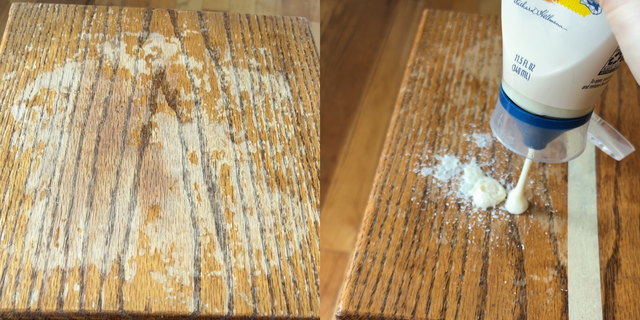a white cup with a blue lid on a wooden surface