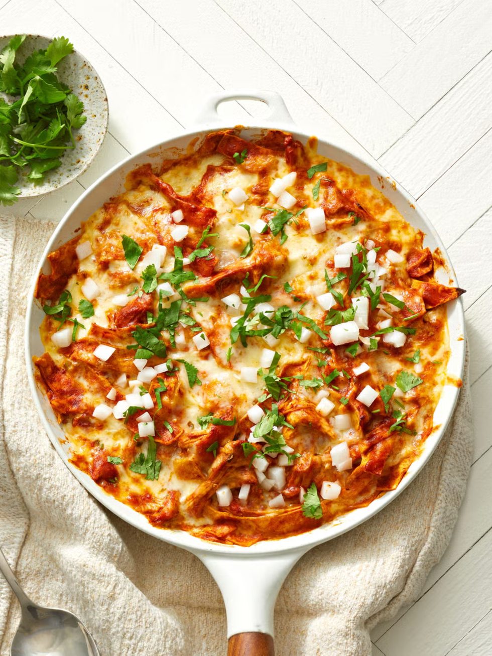 red turkey enchiladas in a skillet
