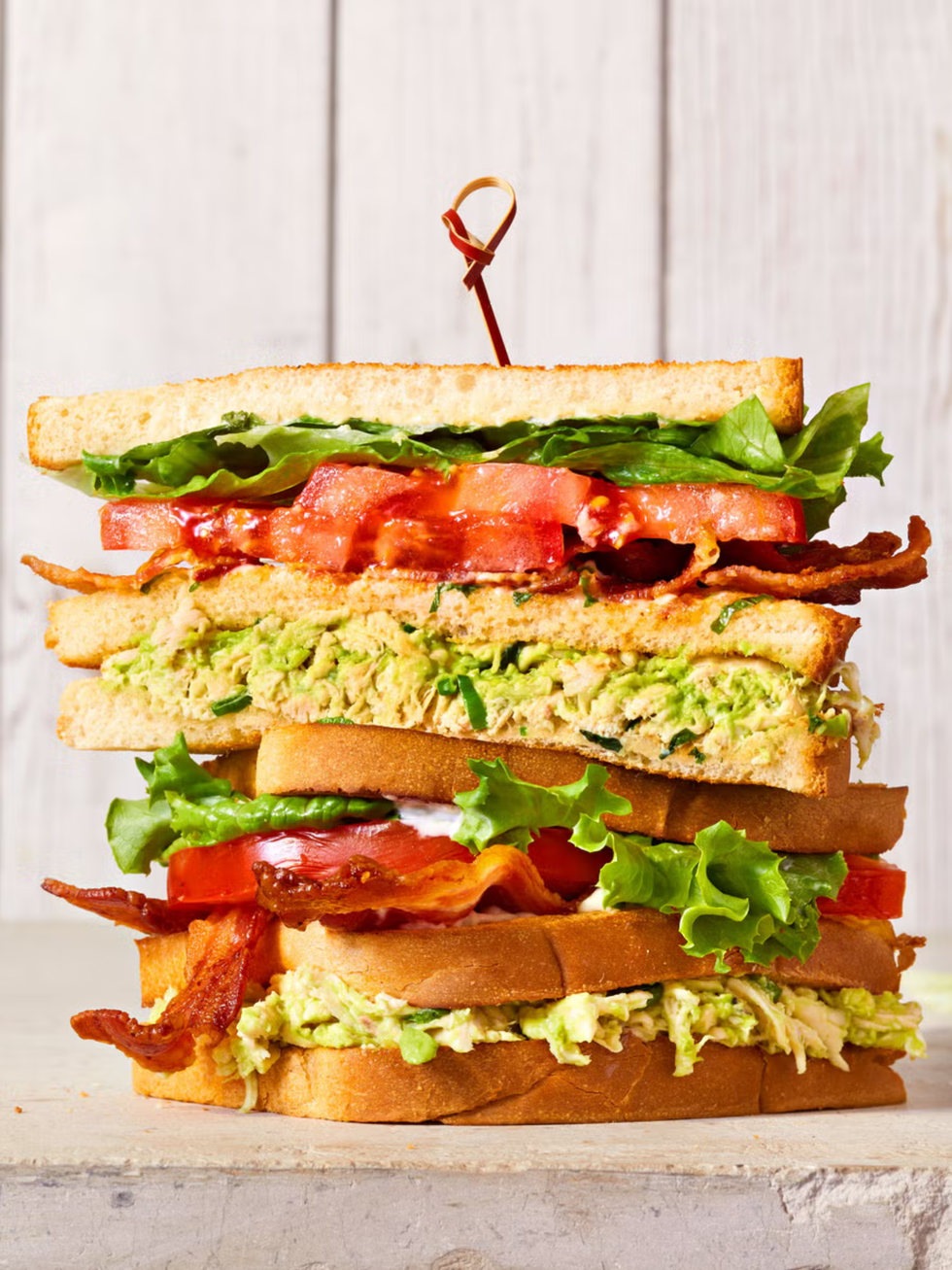 avocado turkey salad club sandwich with bacon and tomato