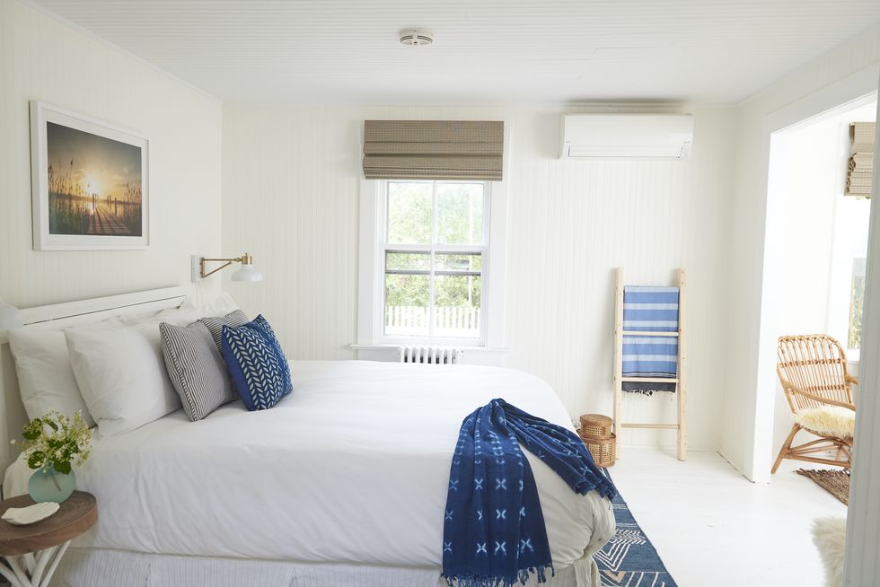 white bedroom with blue accents