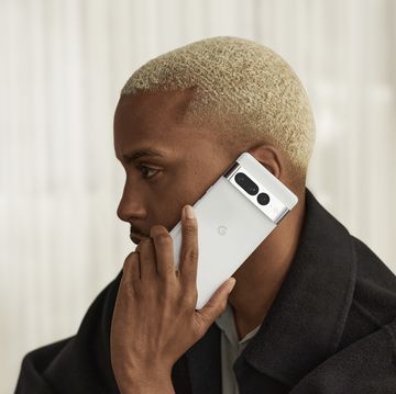 a man holding a google pixel 7 up to his ear