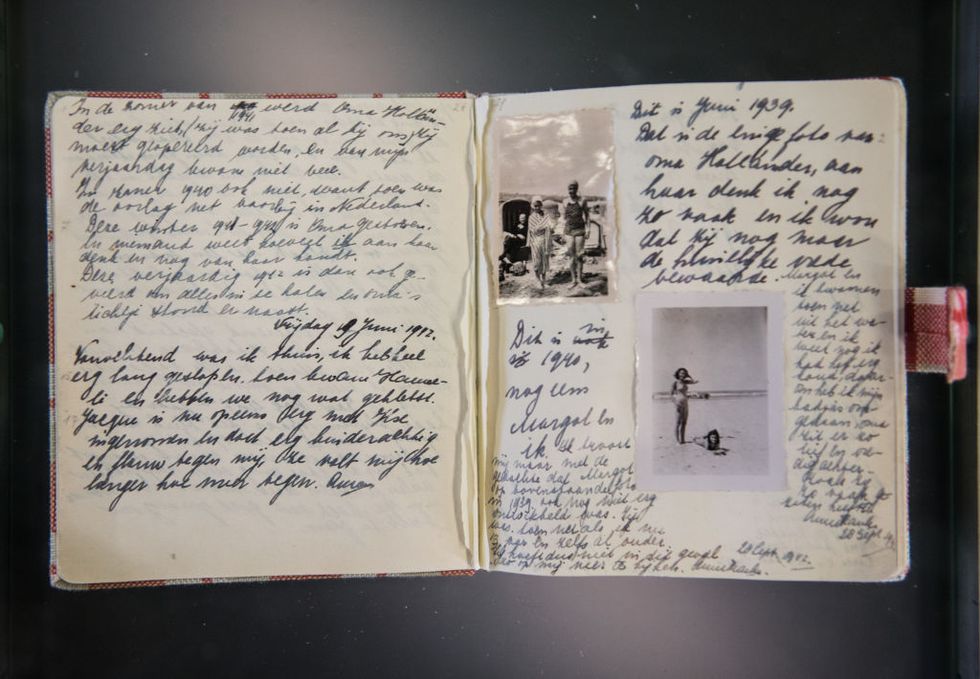 copy of the diary of anne frank open and showing writing and a photo