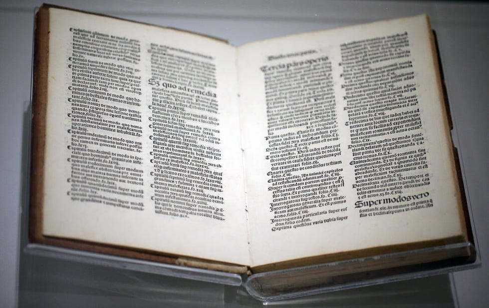 a book rests open as light shines on it