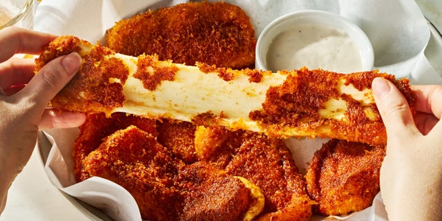 mozzarella sticks covered in hot sauce