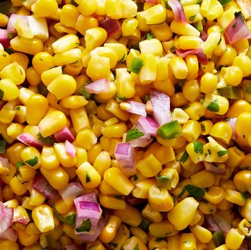 copycat chipotle corn salsa with corn, diced red onions, jalapeño and fresh cilantro