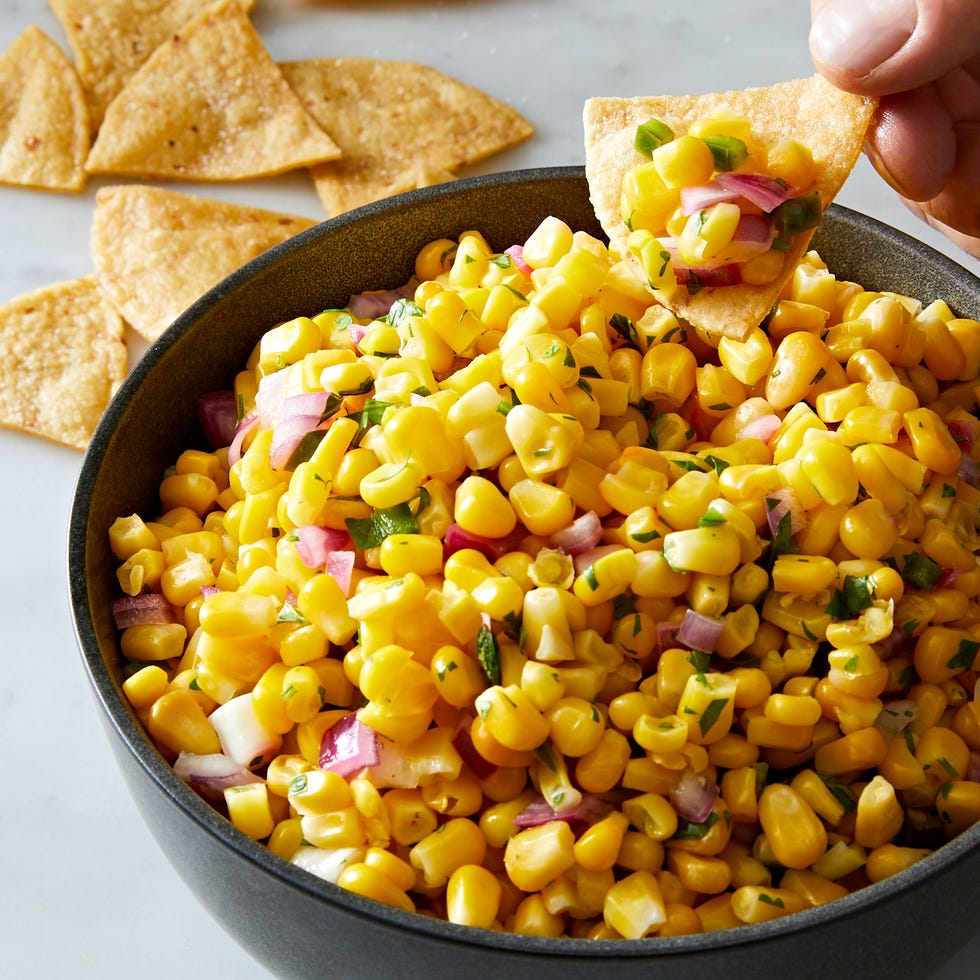 copycat chipotle corn salsa with corn, diced red onions, jalapeño and fresh cilantro