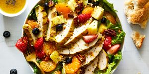 copycat panera bread strawberry poppyseed salad with chicken, mandarin oranges, blueberries, strawberries, and pecans
