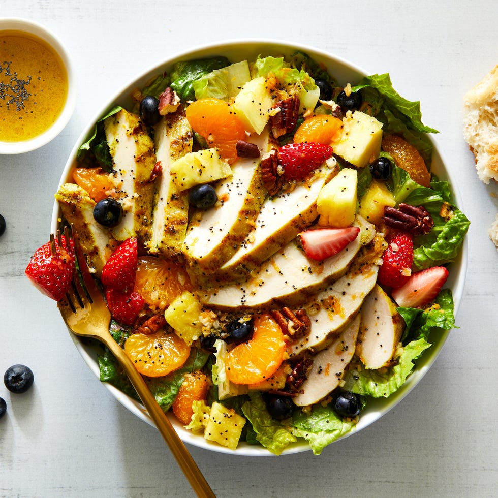 copycat panera bread strawberry poppyseed salad with chicken, mandarin oranges, blueberries, strawberries, and pecans