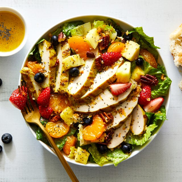 copycat panera bread strawberry poppyseed salad with chicken, mandarin oranges, blueberries, strawberries, and pecans